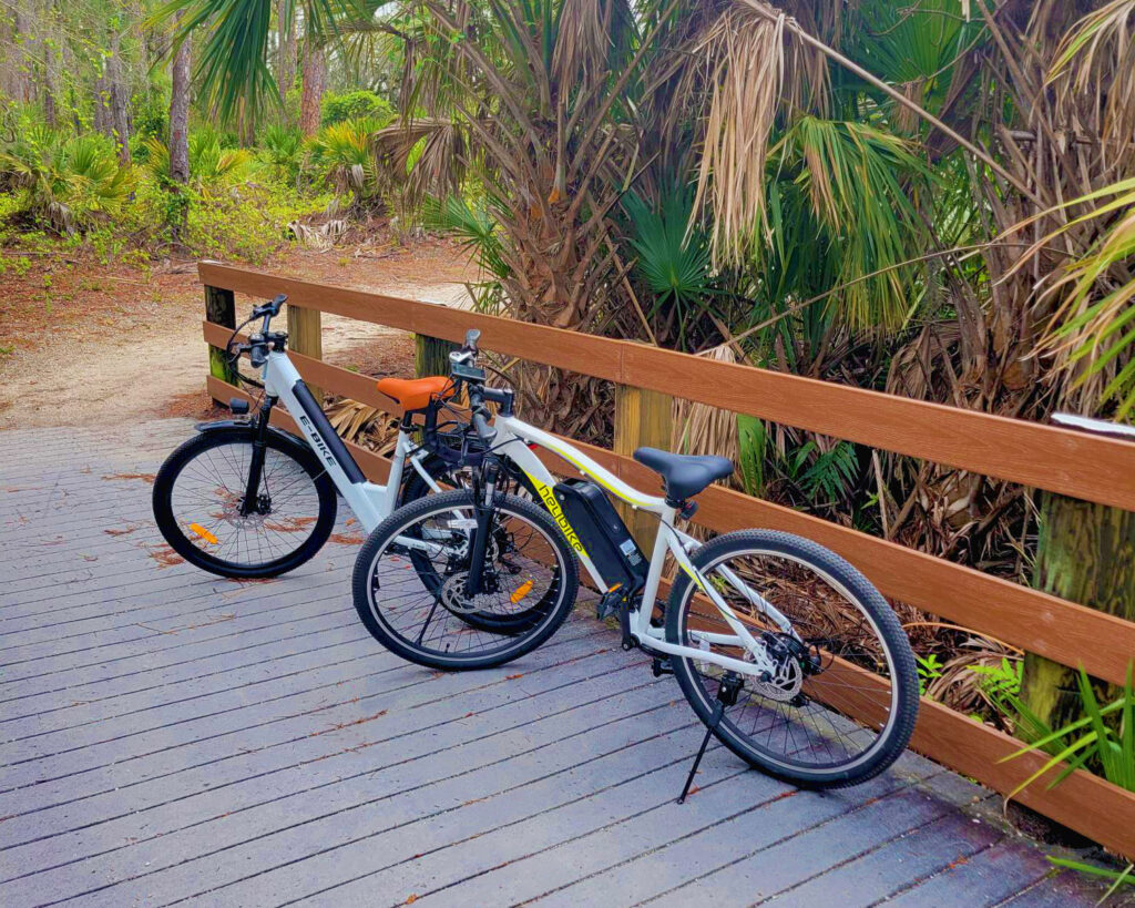 Two eBikes on a board walk in Florida